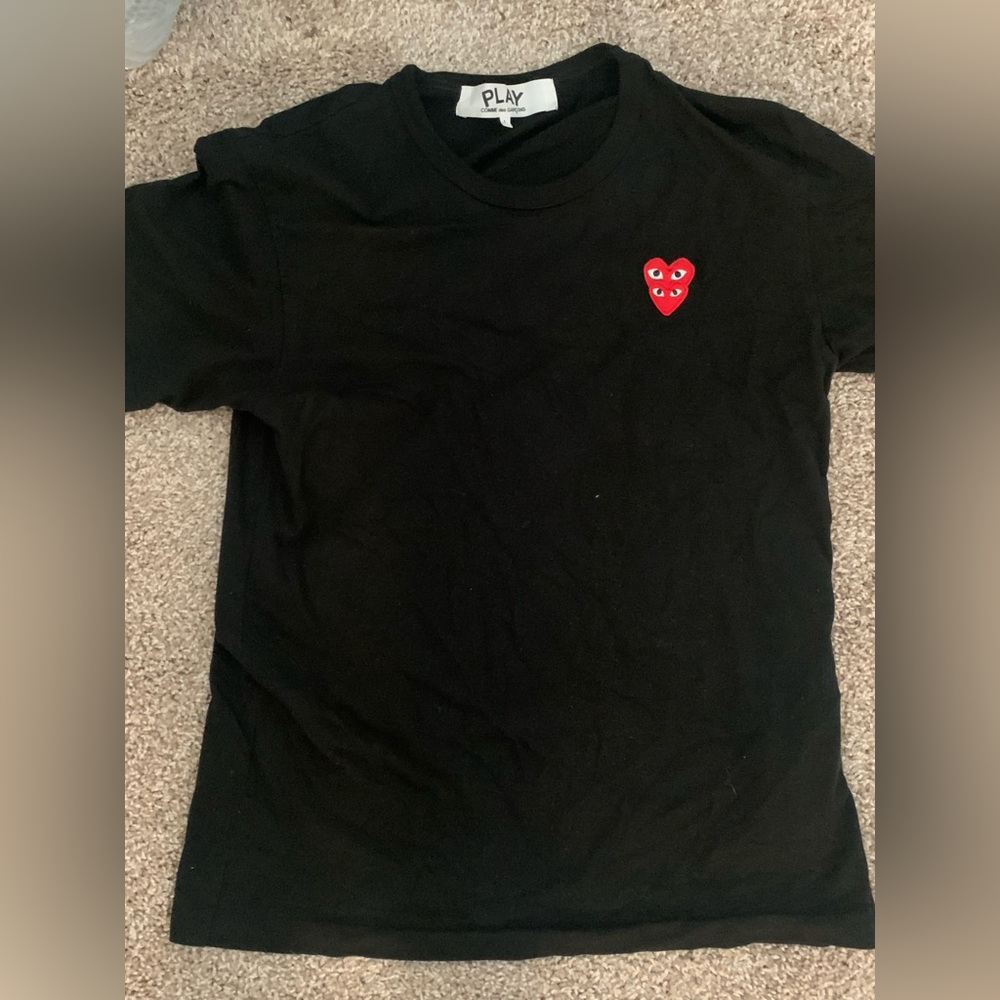 Signature heart patch elevates this classic crewneck tee finished in soft cotton